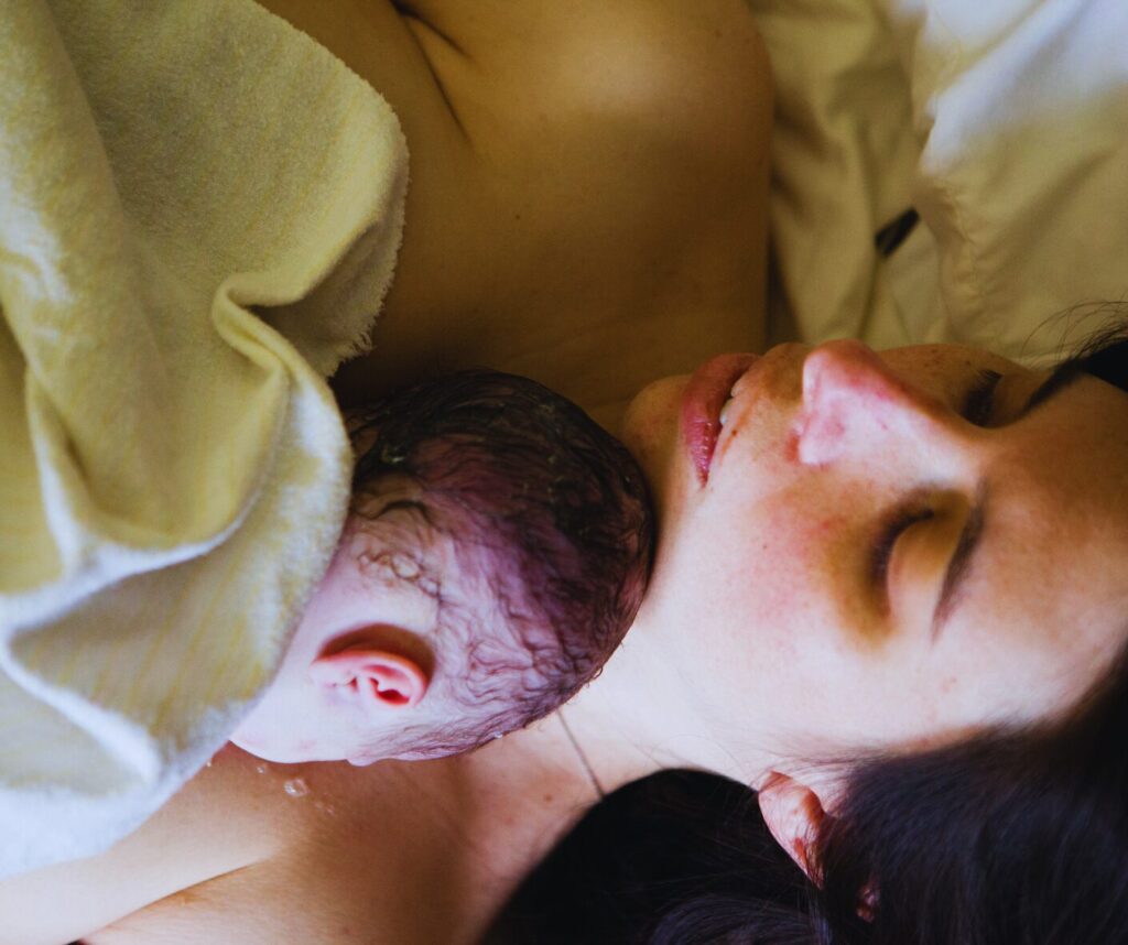 a woman breastfeeding a baby