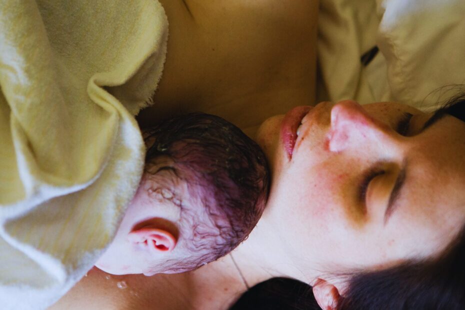 a woman breastfeeding a baby